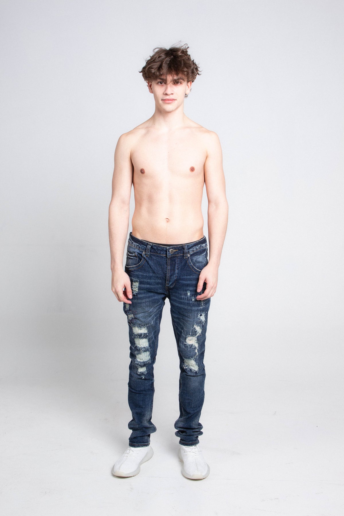 SMALL RIPPED MID-RISE SKINNY JEANS